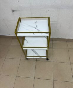 A 3-tier storage or serving cart on wheels, featuring a gold-colored metal frame and white, marble-design shelves. - Image 8