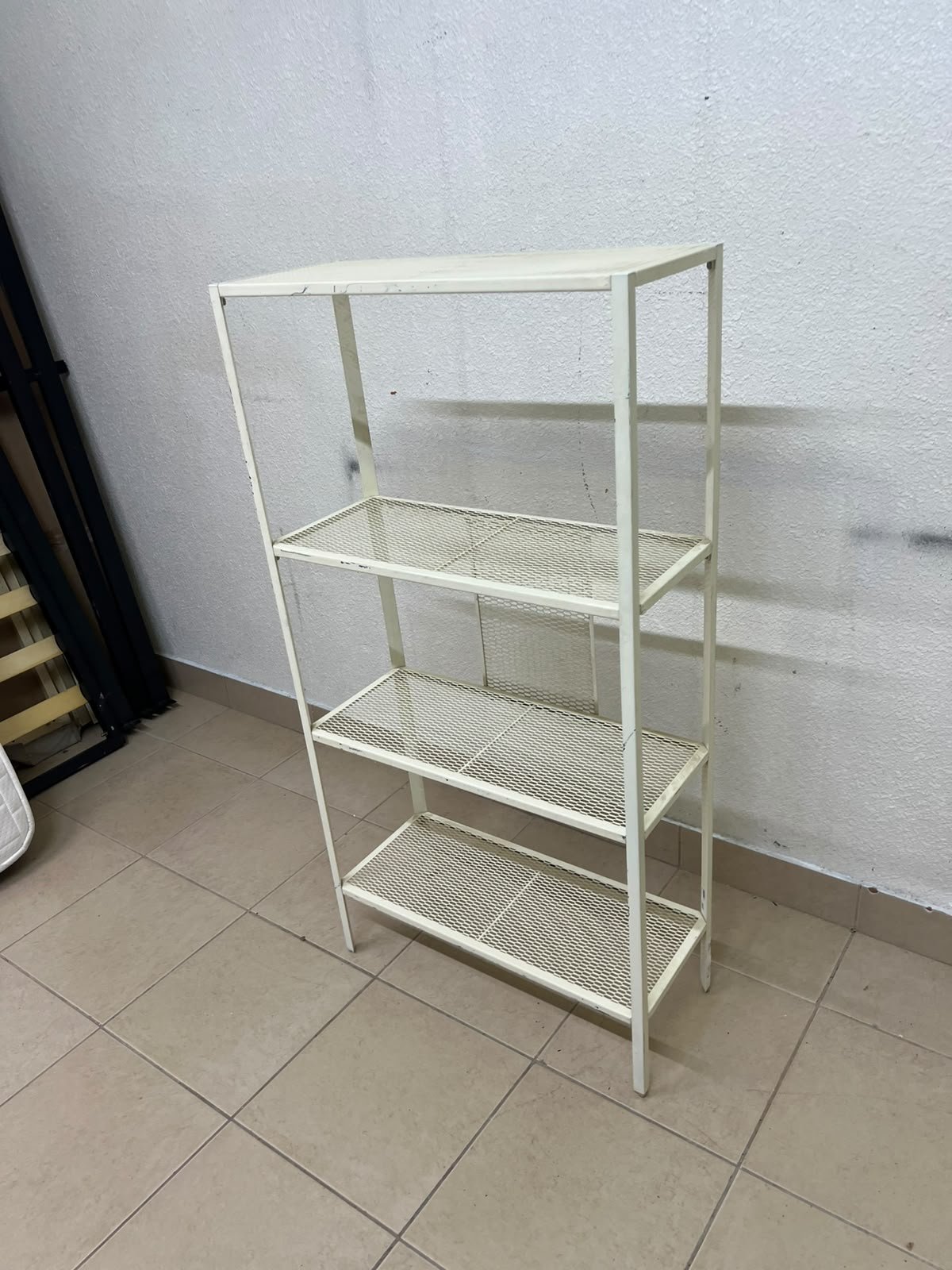 An IKEA shelving unit known as BAGGEBO, made of metal and finished in white. - Image 7