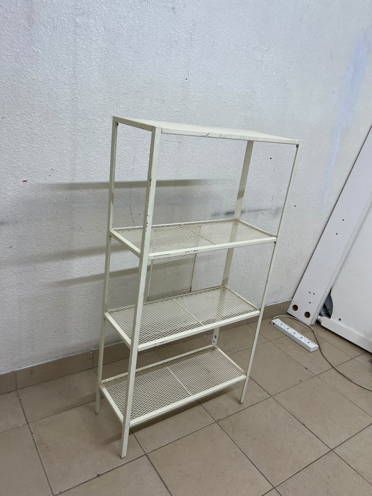 An IKEA shelving unit known as BAGGEBO, made of metal and finished in white. - Image 6
