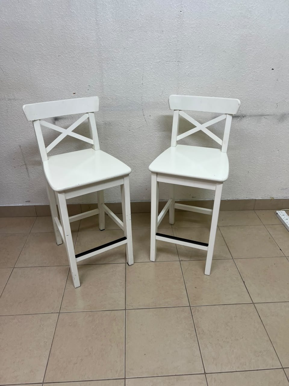 White bar stool with a backrest from IKEA (similar to the ROSENTORP high chair with backrest or the INGOLF model).