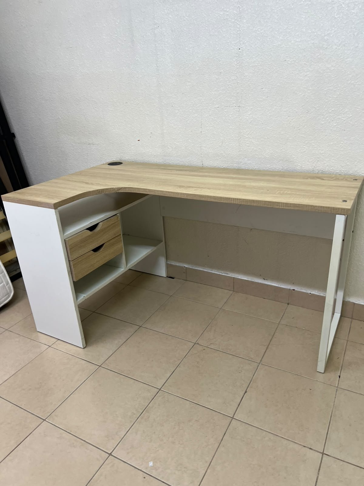 An L-shaped corner desk in white, featuring a light wood-tone (oak) surface and two drawers, complete with side storage units that include two drawers and open shelving. - Image 9