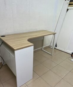 An L-shaped corner desk in white, featuring a light wood-tone (oak) surface and two drawers, complete with side storage units that include two drawers and open shelving. - Image 3