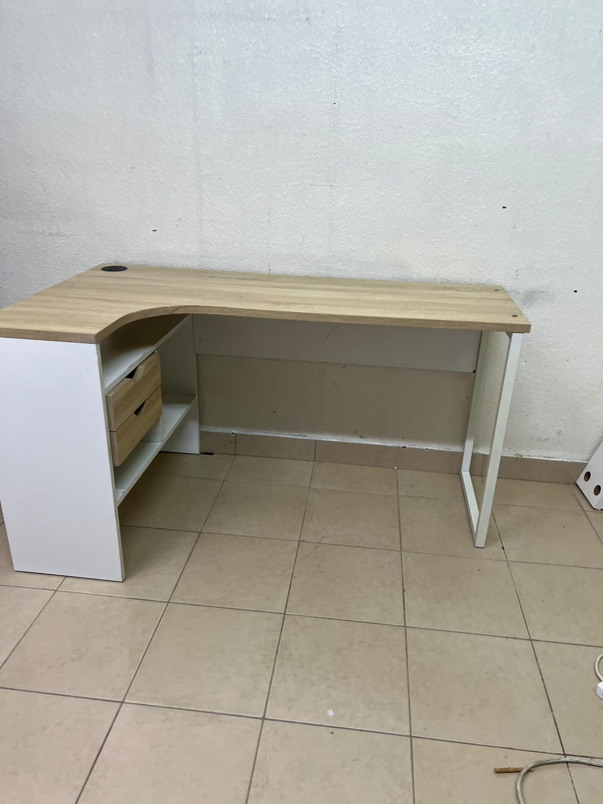 An L-shaped corner desk in white, featuring a light wood-tone (oak) surface and two drawers, complete with side storage units that include two drawers and open shelving. - Image 5