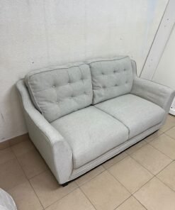 A light gray/beige two-seater fabric sofa featuring button-tufted backrests and short black legs; it closely resembles models such as the Pan Emirates Rosebond two-seater or the Pan Emirates Akli two-seater. - Image 5