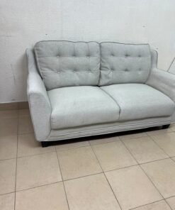 A light gray/beige two-seater fabric sofa featuring button-tufted backrests and short black legs; it closely resembles models such as the Pan Emirates Rosebond two-seater or the Pan Emirates Akli two-seater. - Image 6