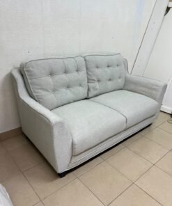 A light gray/beige two-seater fabric sofa featuring button-tufted backrests and short black legs; it closely resembles models such as the Pan Emirates Rosebond two-seater or the Pan Emirates Akli two-seater. - Image 7