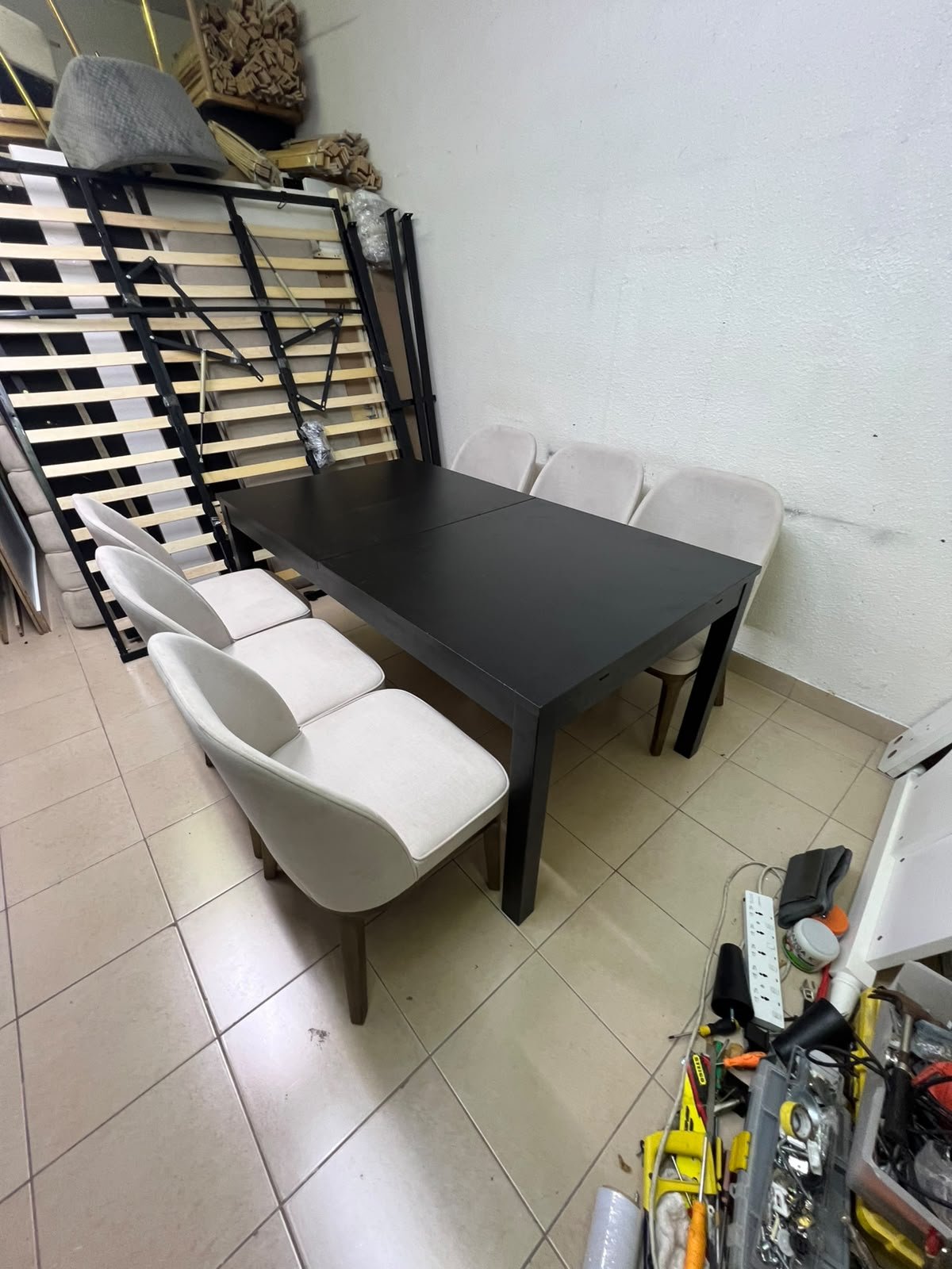 Dining table with 6 chairs: a black, rectangular, extendable wooden table paired with upholstered chairs in a light beige color – an IKEA dining set. - Image 9