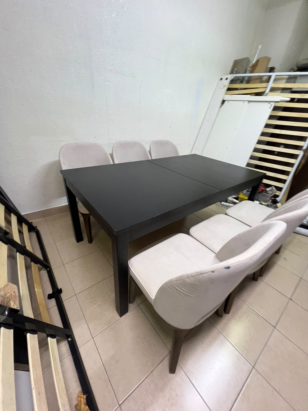 Dining table with 6 chairs: a black, rectangular, extendable wooden table paired with upholstered chairs in a light beige color – an IKEA dining set. - Image 10