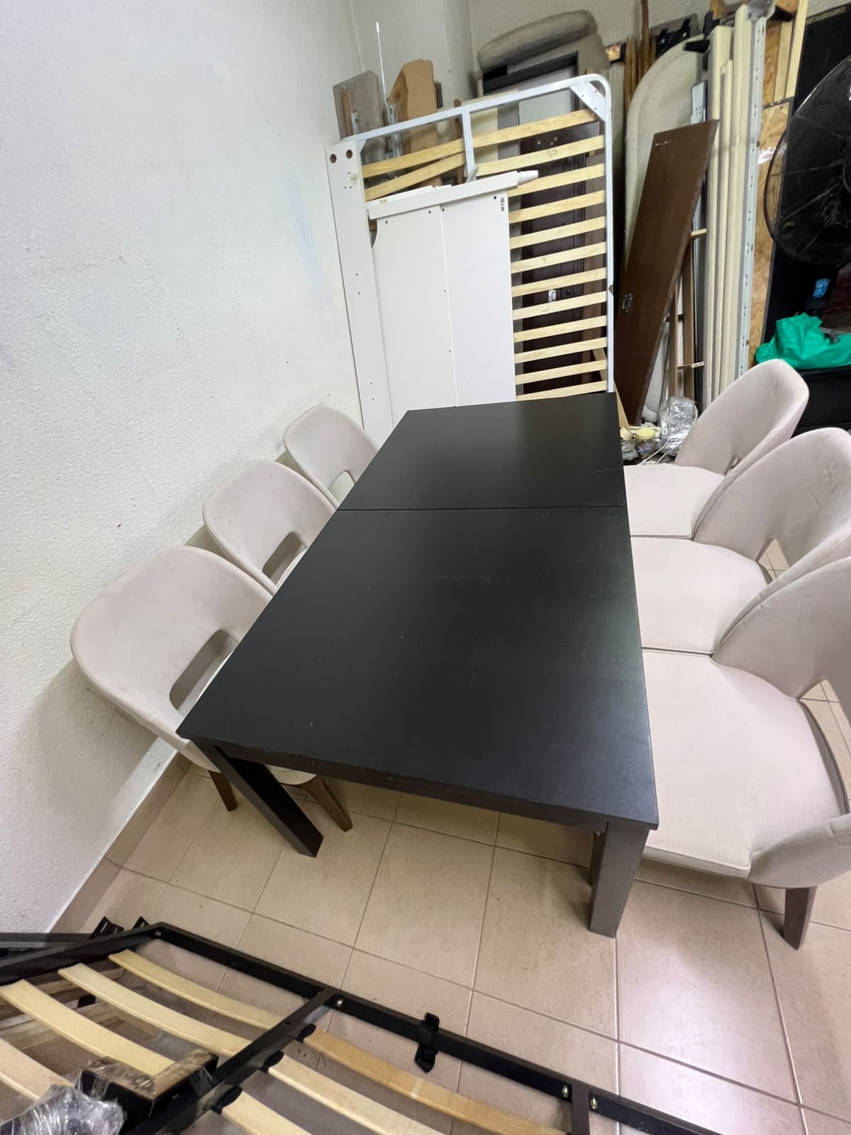 Dining table with 6 chairs: a black, rectangular, extendable wooden table paired with upholstered chairs in a light beige color – an IKEA dining set. - Image 11