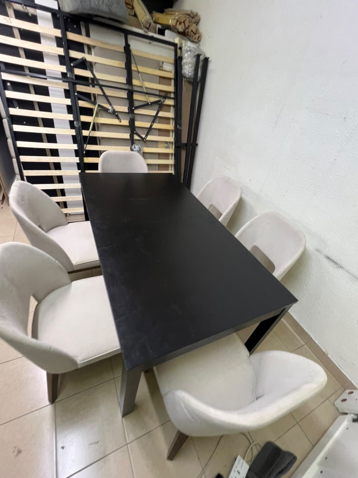 Dining table with 6 chairs: a black, rectangular, extendable wooden table paired with upholstered chairs in a light beige color – an IKEA dining set. - Image 2