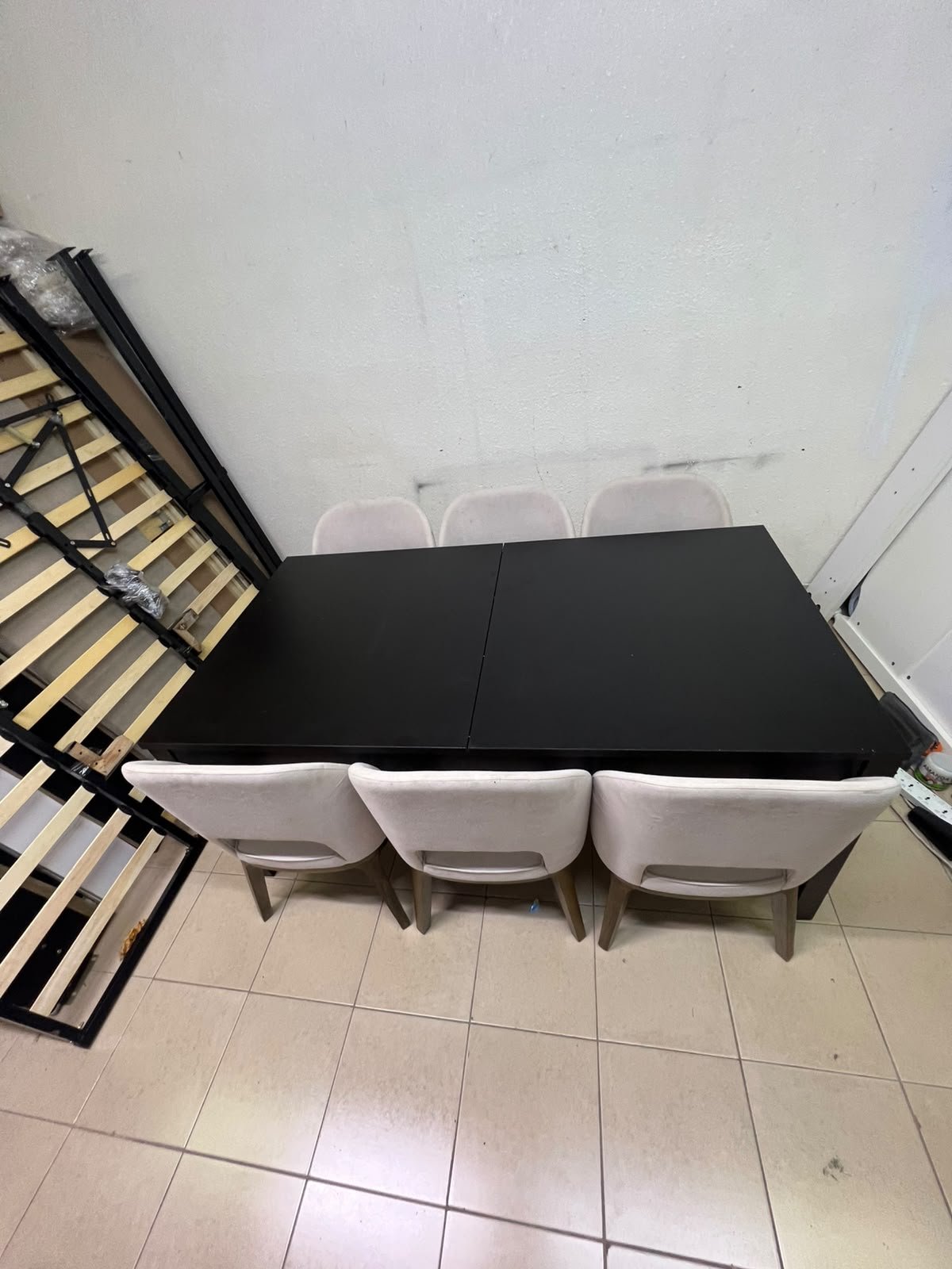Dining table with 6 chairs: a black, rectangular, extendable wooden table paired with upholstered chairs in a light beige color – an IKEA dining set. - Image 3