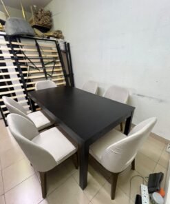 Dining table with 6 chairs: a black, rectangular, extendable wooden table paired with upholstered chairs in a light beige color – an IKEA dining set.