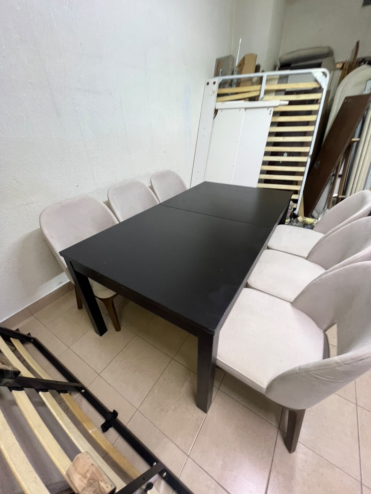 Dining table with 6 chairs: a black, rectangular, extendable wooden table paired with upholstered chairs in a light beige color – an IKEA dining set. - Image 5