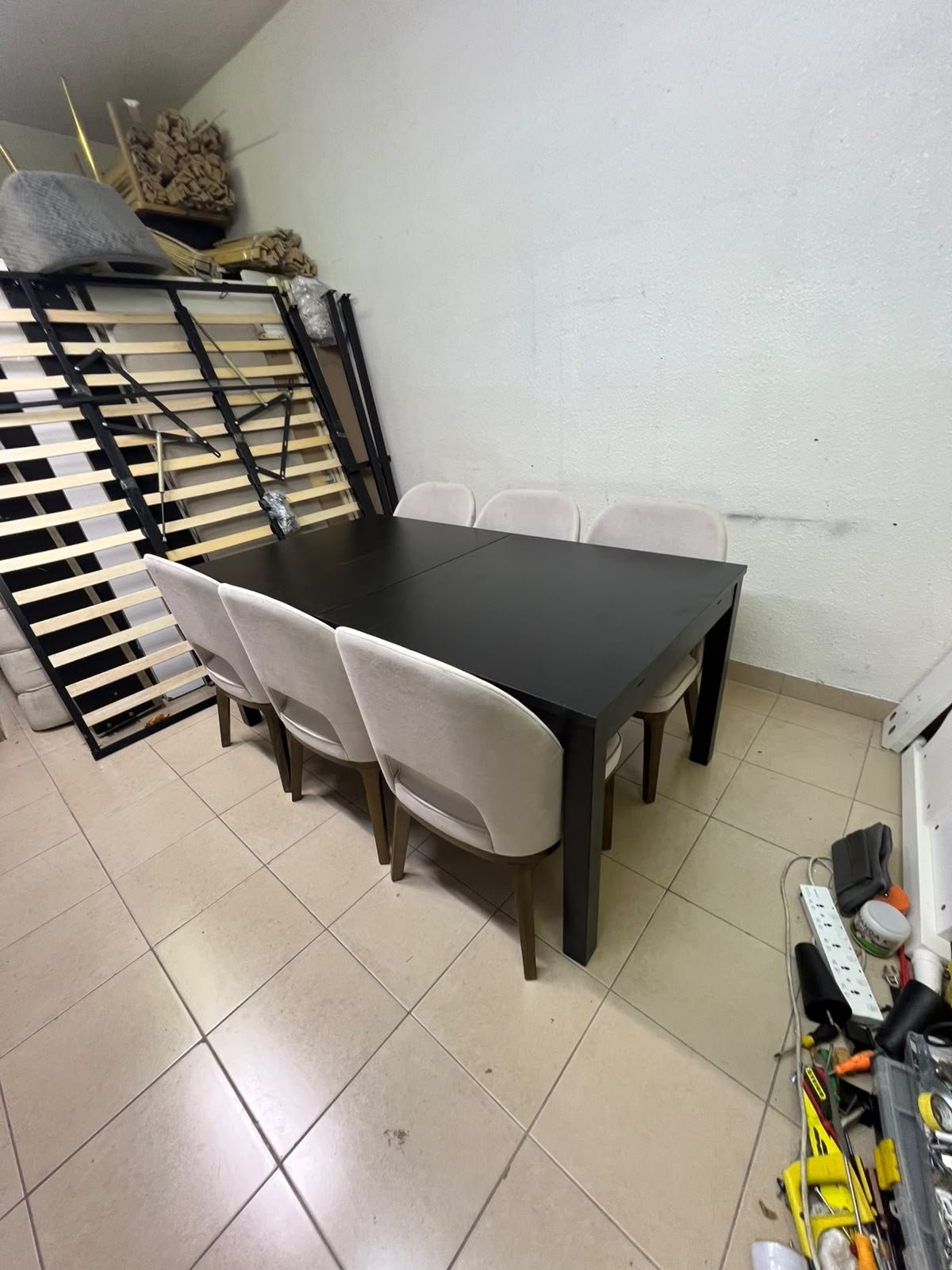 Dining table with 6 chairs: a black, rectangular, extendable wooden table paired with upholstered chairs in a light beige color – an IKEA dining set. - Image 6