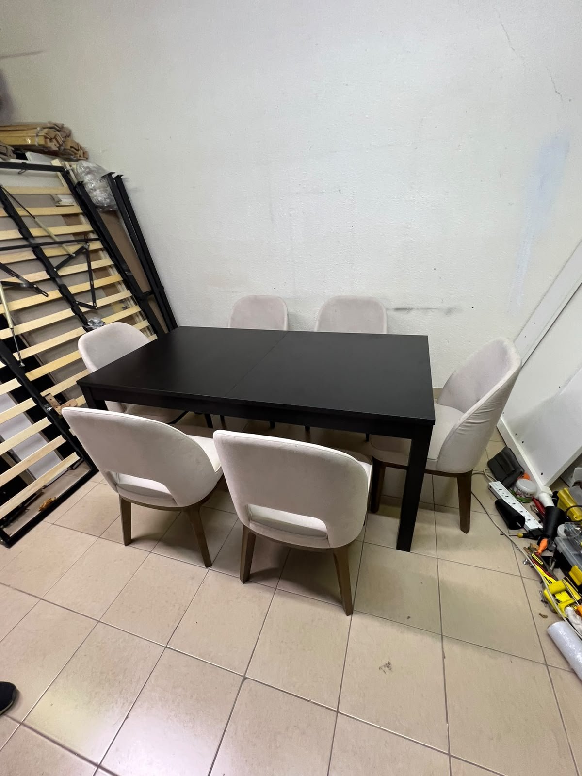 Dining table with 6 chairs: a black, rectangular, extendable wooden table paired with upholstered chairs in a light beige color – an IKEA dining set. - Image 7