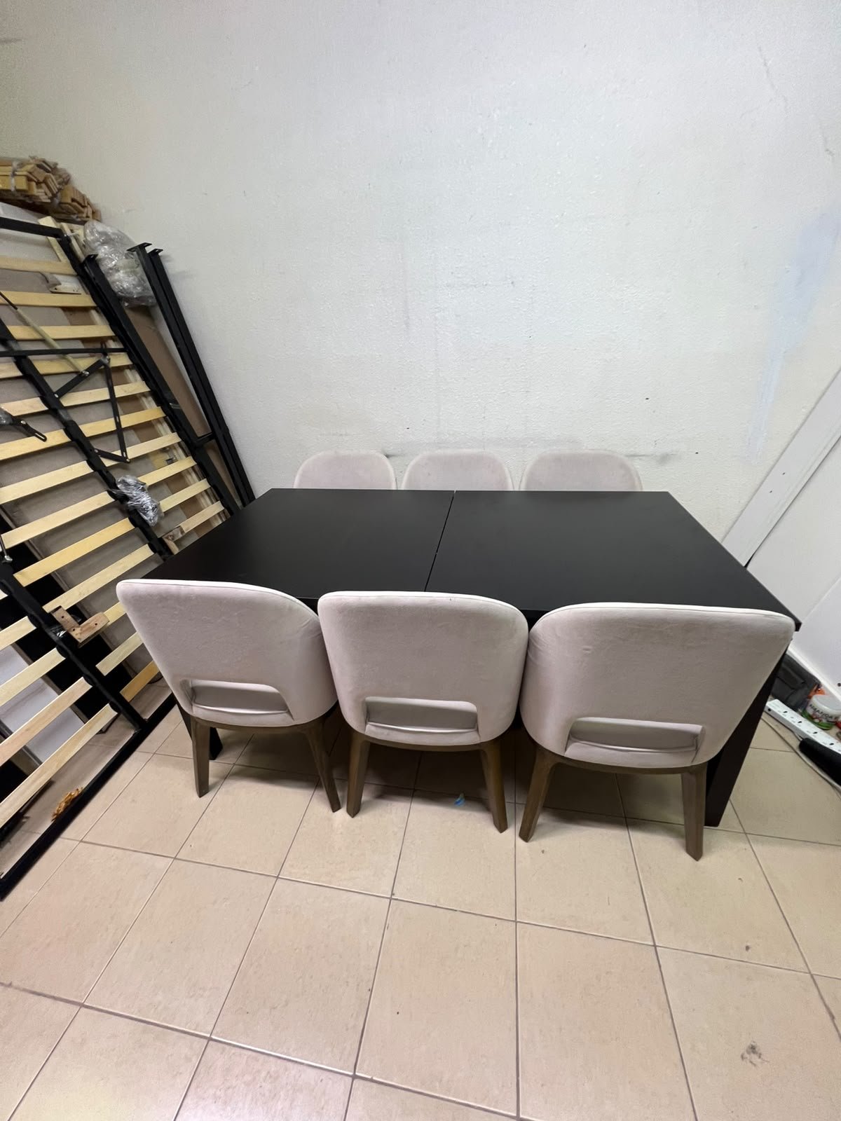 Dining table with 6 chairs: a black, rectangular, extendable wooden table paired with upholstered chairs in a light beige color – an IKEA dining set. - Image 8