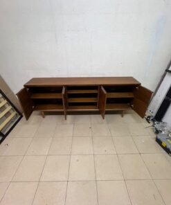 A walnut-wood TV unit or media cabinet from Home Centre, featuring open central shelving, enclosed side cabinets, and slender, tapered legs. - Image 3