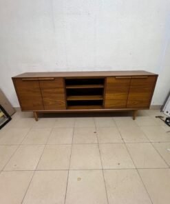 A walnut-wood TV unit or media cabinet from Home Centre, featuring open central shelving, enclosed side cabinets, and slender, tapered legs. - Image 7