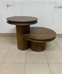 A two-tier side table crafted from natural walnut, featuring a mid-century inspired design—reminiscent of iconic pieces such as the "Oro" table from Crate & Barrel or Scandinavian-style tiered tables.