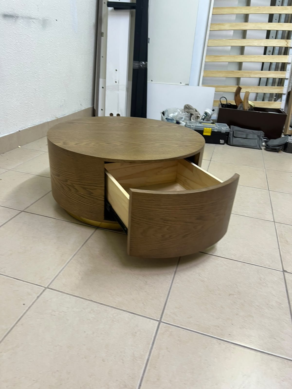 A round, dark oak-colored wooden coffee table, featuring an elegant, modern design with a curved storage drawer equipped with concealed or recessed handles. - Image 6