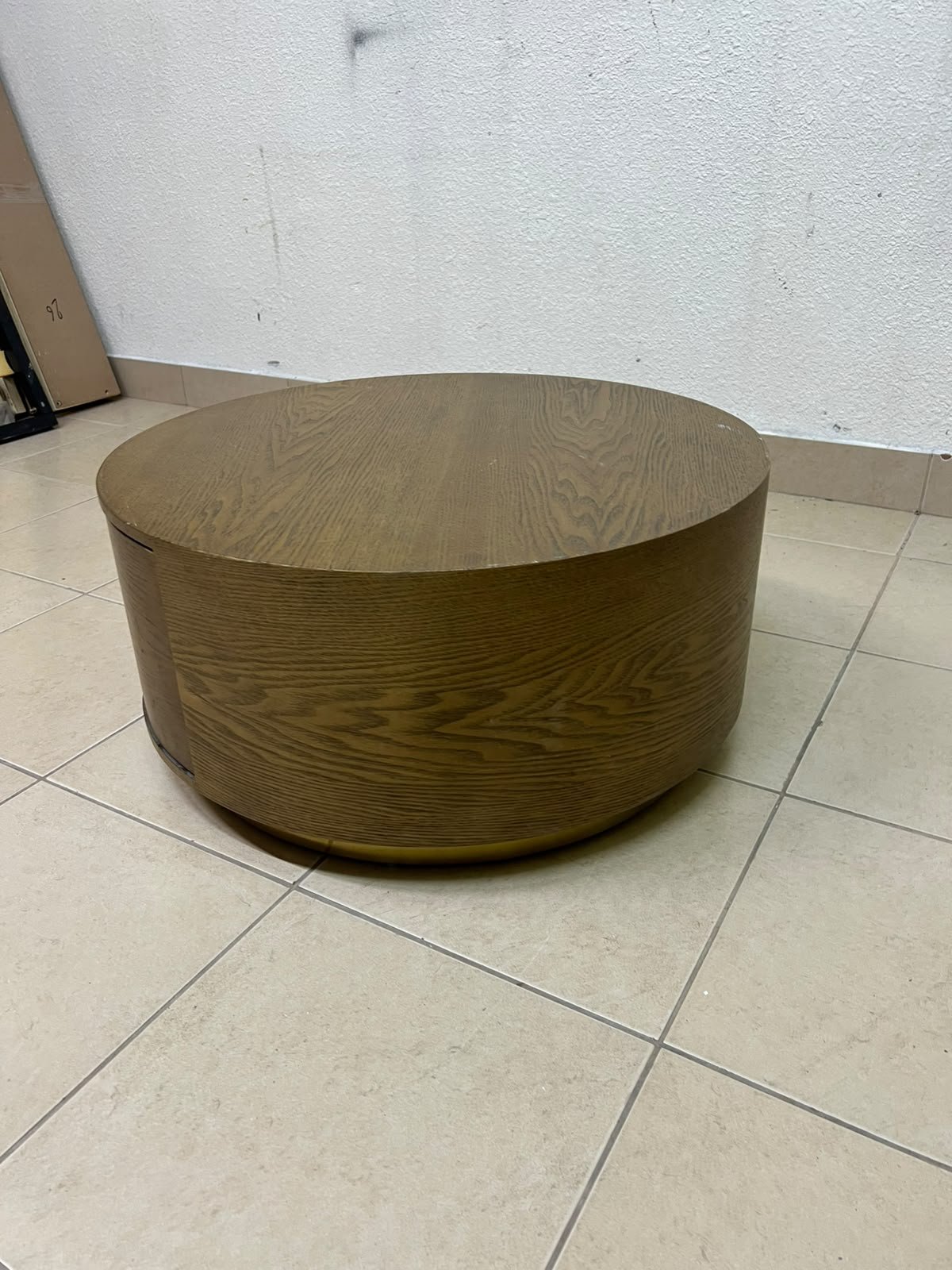 A round, dark oak-colored wooden coffee table, featuring an elegant, modern design with a curved storage drawer equipped with concealed or recessed handles. - Image 7