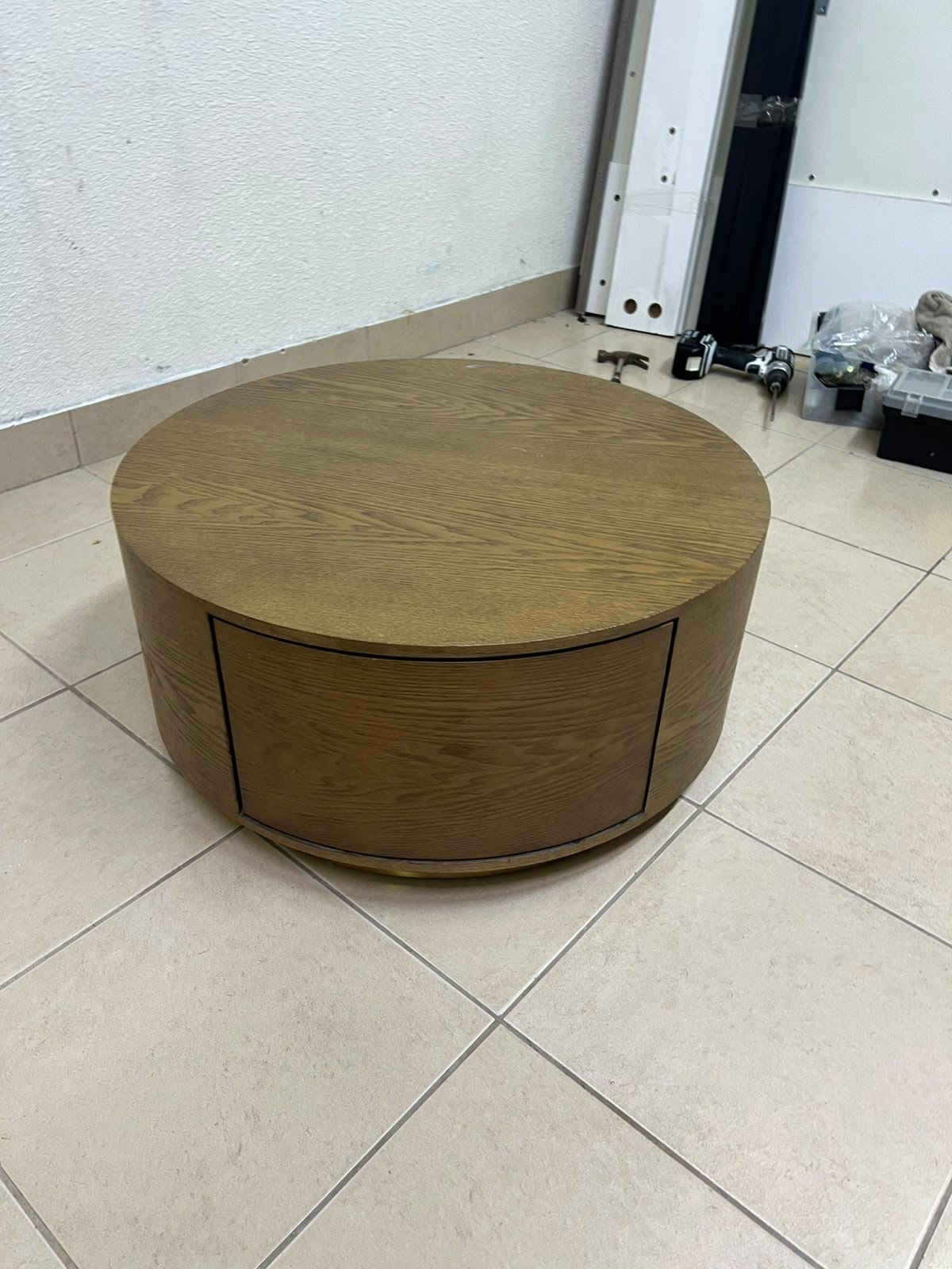A round, dark oak-colored wooden coffee table, featuring an elegant, modern design with a curved storage drawer equipped with concealed or recessed handles. - Image 8