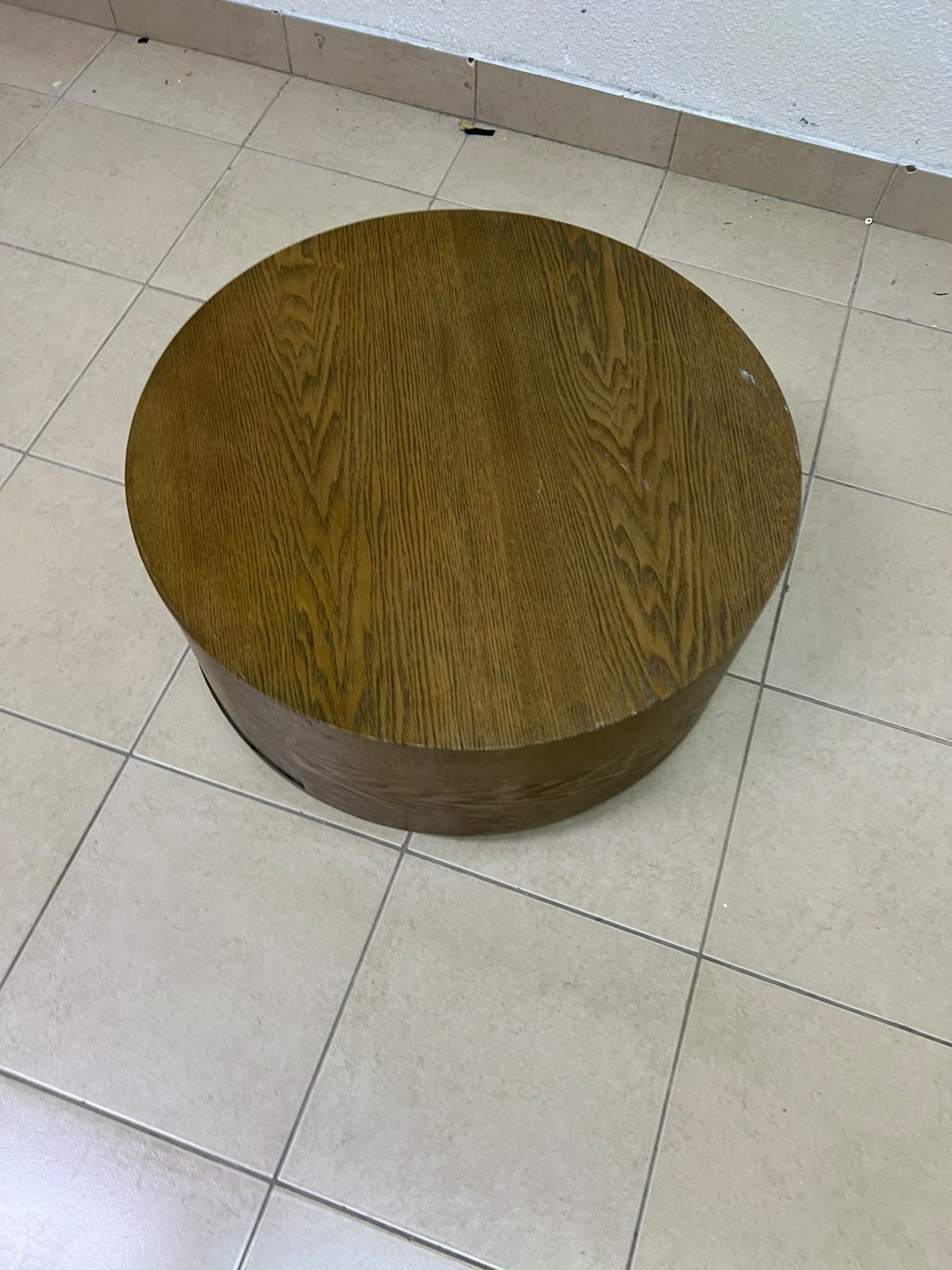 A round, dark oak-colored wooden coffee table, featuring an elegant, modern design with a curved storage drawer equipped with concealed or recessed handles. - Image 2