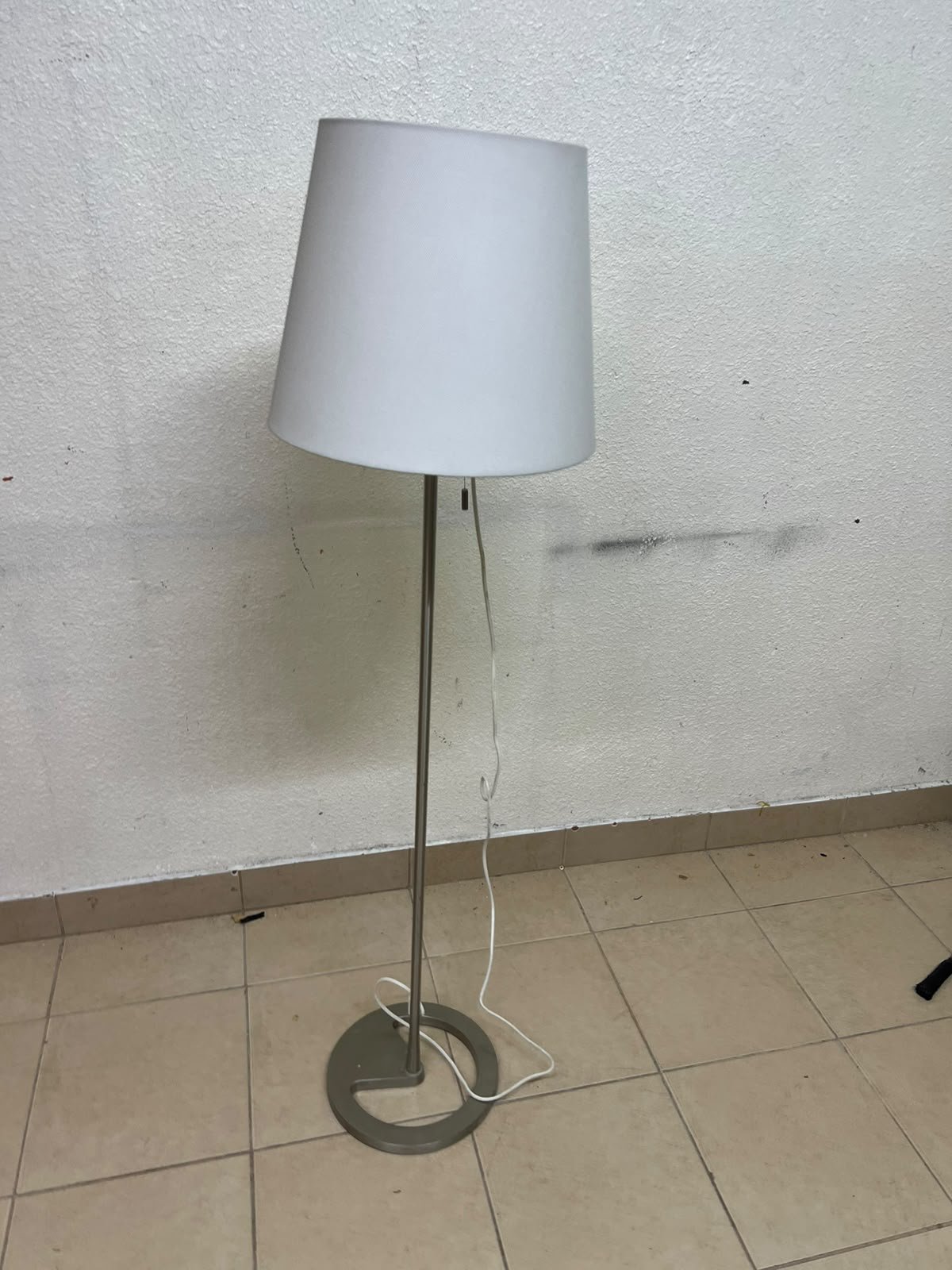 IKEA NYFORS floor lamp (nickel-plated finish with a white fabric shade),