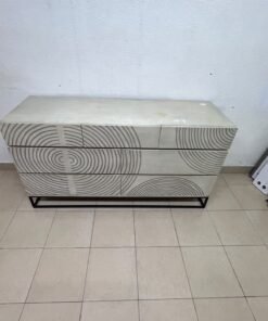 A chest of drawers featuring a geometric design with raised circular patterns—known as the 7-drawer "Circulus" chest from Crate & Barrel, or a very similar design from the "Gerald" collection by Home Centre. - Image 3