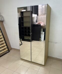 A two-door hinged wardrobe with full mirrors, available in oak or natural beige (IKEA wardrobe)