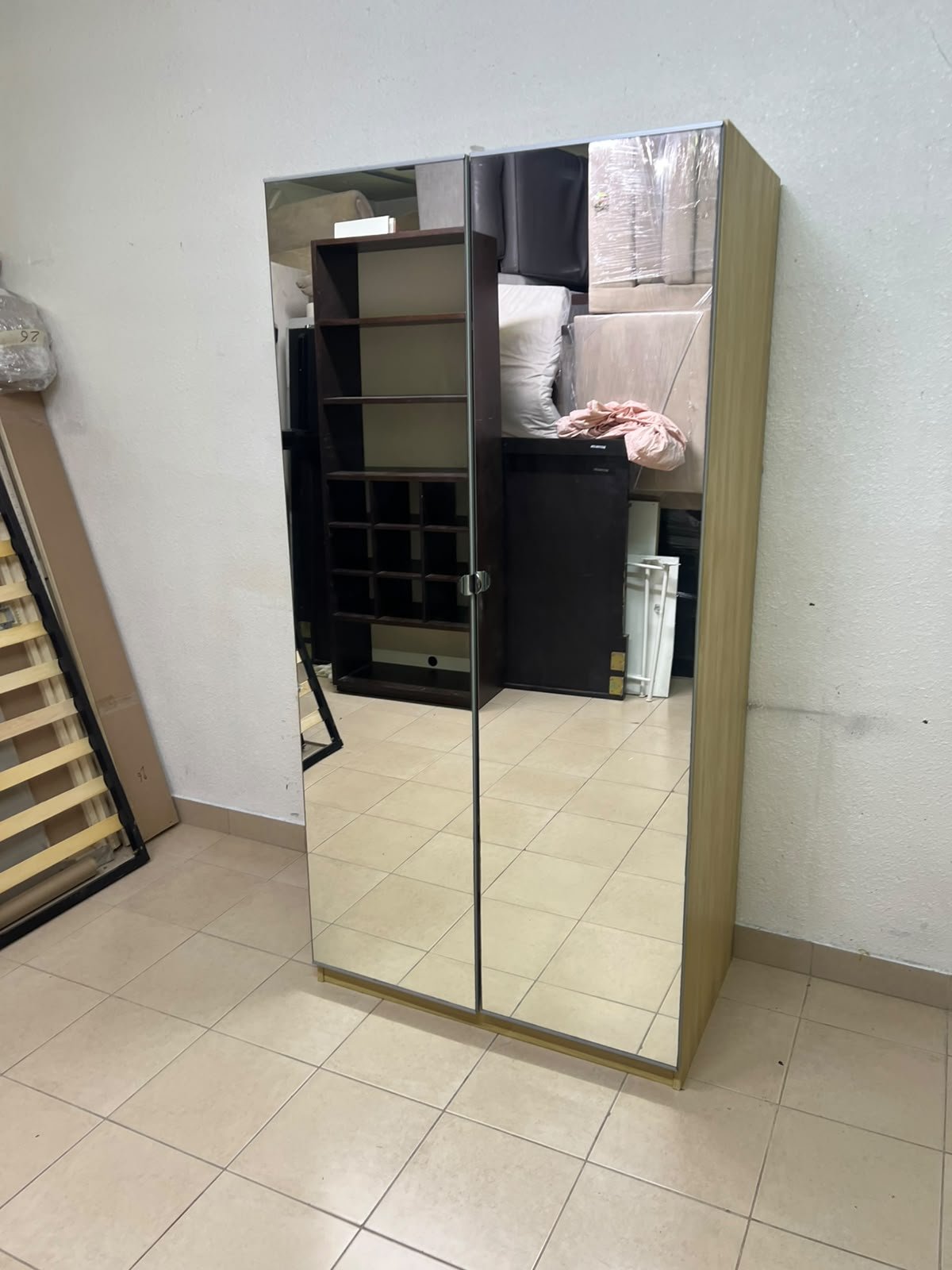 A two-door hinged wardrobe with full mirrors, available in oak or natural beige (IKEA wardrobe)