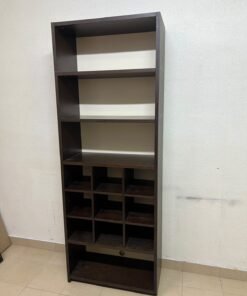 A tall, dark brown (black-brown or wenge-colored) wooden storage unit, featuring open shelves at the top and 12 small compartments (storage squares) in the lower section.