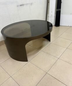 A round coffee table featuring a curved base in a bronze or metallic brown finish, topped with a smoked (tempered) glass surface. - Image 7