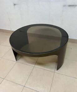 A round coffee table featuring a curved base in a bronze or metallic brown finish, topped with a smoked (tempered) glass surface. - Image 3
