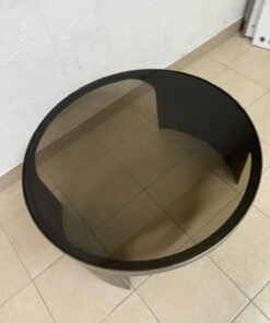 A round coffee table featuring a curved base in a bronze or metallic brown finish, topped with a smoked (tempered) glass surface. - Image 2