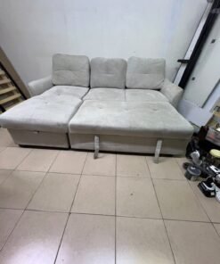 # Convertible Fabric Corner Sofa Bed with Chaise Longue and Storage – Home Box UAE Upgrade your living room with this practical and stylish convertible fabric corner sofa bed from Home Box UAE, designed to combine comfort, functionality, and modern elegance in one versatile piece of furniture. Featuring a spacious three-seater design with an extended chaise longue, this sofa provides plenty of room for relaxing, watching television, entertaining guests, or spending quality time with family. Its attractive fabric upholstery adds a warm and welcoming touch to any living space, making it an excellent choice for apartments, villas, guest rooms, and modern homes. One of the main advantages of this corner sofa is its convertible sofa-bed function, which allows you to transform the seating area into a comfortable sleeping space whenever needed. This practical feature makes it especially suitable for homes where extra sleeping arrangements are occasionally required without sacrificing valuable floor space. Whether you have overnight visitors or simply want a comfortable place to stretch out and relax, this multifunctional design offers flexibility for everyday living. The extended chaise longue provides additional legroom, allowing you to sit back comfortably, read a book, enjoy your favourite shows, or take a relaxing afternoon nap. The spacious seating arrangement makes it suitable for individuals, couples, and families looking for furniture that offers both convenience and comfort. Another useful feature is the integrated storage compartment, which provides extra room for keeping blankets, pillows, bedsheets, cushions, and other household essentials neatly organised and within easy reach. With its combination of seating, sleeping, and storage functions, this fabric corner sofa is an excellent space-saving solution for contemporary interiors. Its versatile design allows it to serve as the main sofa in a living room while also functioning as a guest bed and a convenient storage unit. The fabric finish complements a variety of interior styles, including modern, minimalist, contemporary, and casual home décor, making it easy to incorporate into different living environments. If you are searching for an affordable and functional sofa bed in Dubai, Sharjah, or Ajman, this Home Box-style convertible corner sofa is worth considering for its practical features and versatile use. It is particularly suitable for people furnishing a new apartment, upgrading their existing living room, or looking for multifunctional furniture that makes the most of available space. At Yahya Used Furniture, we offer a wide selection of second-hand furniture for customers looking for practical home furnishing solutions at affordable prices. If you are interested in buying a used corner sofa, sofa bed, chaise longue, or other living room furniture, explore our available collection to discover options that suit your space and budget. Choose a sofa that brings together comfortable seating, flexible sleeping arrangements, and useful storage in one convenient design. This convertible fabric corner sofa bed is a practical furniture choice for making your living room more comfortable, organised, and ready for everyday life. - Image 3
