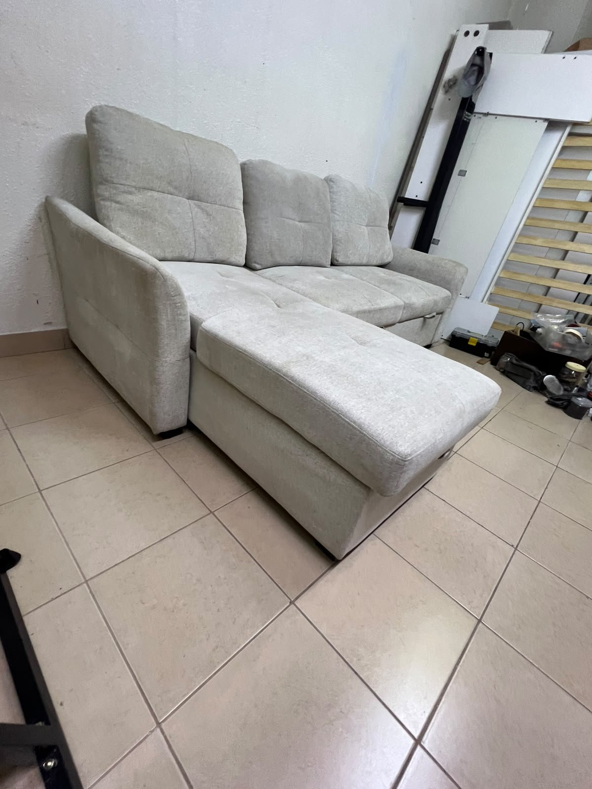 # Convertible Fabric Corner Sofa Bed with Chaise Longue and Storage – Home Box UAE Upgrade your living room with this practical and stylish convertible fabric corner sofa bed from Home Box UAE, designed to combine comfort, functionality, and modern elegance in one versatile piece of furniture. Featuring a spacious three-seater design with an extended chaise longue, this sofa provides plenty of room for relaxing, watching television, entertaining guests, or spending quality time with family. Its attractive fabric upholstery adds a warm and welcoming touch to any living space, making it an excellent choice for apartments, villas, guest rooms, and modern homes. One of the main advantages of this corner sofa is its convertible sofa-bed function, which allows you to transform the seating area into a comfortable sleeping space whenever needed. This practical feature makes it especially suitable for homes where extra sleeping arrangements are occasionally required without sacrificing valuable floor space. Whether you have overnight visitors or simply want a comfortable place to stretch out and relax, this multifunctional design offers flexibility for everyday living. The extended chaise longue provides additional legroom, allowing you to sit back comfortably, read a book, enjoy your favourite shows, or take a relaxing afternoon nap. The spacious seating arrangement makes it suitable for individuals, couples, and families looking for furniture that offers both convenience and comfort. Another useful feature is the integrated storage compartment, which provides extra room for keeping blankets, pillows, bedsheets, cushions, and other household essentials neatly organised and within easy reach. With its combination of seating, sleeping, and storage functions, this fabric corner sofa is an excellent space-saving solution for contemporary interiors. Its versatile design allows it to serve as the main sofa in a living room while also functioning as a guest bed and a convenient storage unit. The fabric finish complements a variety of interior styles, including modern, minimalist, contemporary, and casual home décor, making it easy to incorporate into different living environments. If you are searching for an affordable and functional sofa bed in Dubai, Sharjah, or Ajman, this Home Box-style convertible corner sofa is worth considering for its practical features and versatile use. It is particularly suitable for people furnishing a new apartment, upgrading their existing living room, or looking for multifunctional furniture that makes the most of available space. At Yahya Used Furniture, we offer a wide selection of second-hand furniture for customers looking for practical home furnishing solutions at affordable prices. If you are interested in buying a used corner sofa, sofa bed, chaise longue, or other living room furniture, explore our available collection to discover options that suit your space and budget. Choose a sofa that brings together comfortable seating, flexible sleeping arrangements, and useful storage in one convenient design. This convertible fabric corner sofa bed is a practical furniture choice for making your living room more comfortable, organised, and ready for everyday life. - Image 5