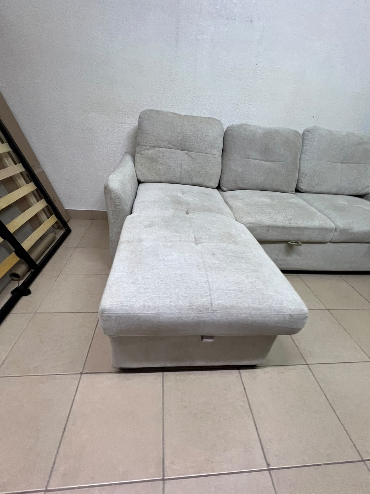 # Convertible Fabric Corner Sofa Bed with Chaise Longue and Storage – Home Box UAE Upgrade your living room with this practical and stylish convertible fabric corner sofa bed from Home Box UAE, designed to combine comfort, functionality, and modern elegance in one versatile piece of furniture. Featuring a spacious three-seater design with an extended chaise longue, this sofa provides plenty of room for relaxing, watching television, entertaining guests, or spending quality time with family. Its attractive fabric upholstery adds a warm and welcoming touch to any living space, making it an excellent choice for apartments, villas, guest rooms, and modern homes. One of the main advantages of this corner sofa is its convertible sofa-bed function, which allows you to transform the seating area into a comfortable sleeping space whenever needed. This practical feature makes it especially suitable for homes where extra sleeping arrangements are occasionally required without sacrificing valuable floor space. Whether you have overnight visitors or simply want a comfortable place to stretch out and relax, this multifunctional design offers flexibility for everyday living. The extended chaise longue provides additional legroom, allowing you to sit back comfortably, read a book, enjoy your favourite shows, or take a relaxing afternoon nap. The spacious seating arrangement makes it suitable for individuals, couples, and families looking for furniture that offers both convenience and comfort. Another useful feature is the integrated storage compartment, which provides extra room for keeping blankets, pillows, bedsheets, cushions, and other household essentials neatly organised and within easy reach. With its combination of seating, sleeping, and storage functions, this fabric corner sofa is an excellent space-saving solution for contemporary interiors. Its versatile design allows it to serve as the main sofa in a living room while also functioning as a guest bed and a convenient storage unit. The fabric finish complements a variety of interior styles, including modern, minimalist, contemporary, and casual home décor, making it easy to incorporate into different living environments. If you are searching for an affordable and functional sofa bed in Dubai, Sharjah, or Ajman, this Home Box-style convertible corner sofa is worth considering for its practical features and versatile use. It is particularly suitable for people furnishing a new apartment, upgrading their existing living room, or looking for multifunctional furniture that makes the most of available space. At Yahya Used Furniture, we offer a wide selection of second-hand furniture for customers looking for practical home furnishing solutions at affordable prices. If you are interested in buying a used corner sofa, sofa bed, chaise longue, or other living room furniture, explore our available collection to discover options that suit your space and budget. Choose a sofa that brings together comfortable seating, flexible sleeping arrangements, and useful storage in one convenient design. This convertible fabric corner sofa bed is a practical furniture choice for making your living room more comfortable, organised, and ready for everyday life. - Image 8