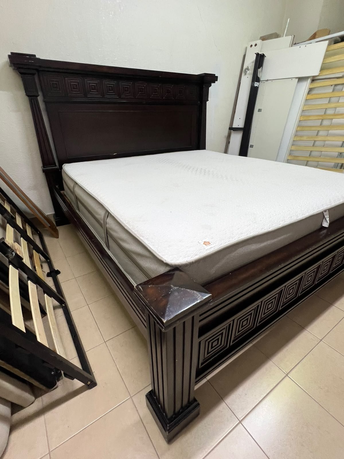 Large, classic double bed (king-size) with mattress, crafted from dark wood and featuring a headboard and footboard adorned with square-patterned detailing. - Image 9