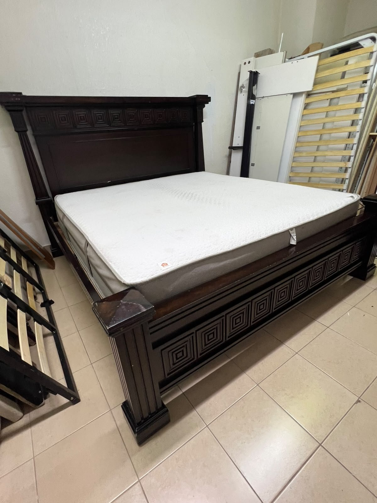 Large, classic double bed (king-size) with mattress, crafted from dark wood and featuring a headboard and footboard adorned with square-patterned detailing. - Image 10