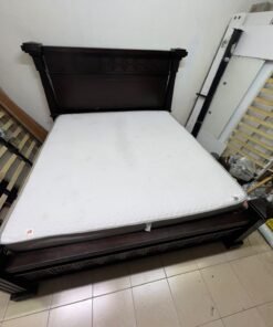 Large, classic double bed (king-size) with mattress, crafted from dark wood and featuring a headboard and footboard adorned with square-patterned detailing. - Image 3