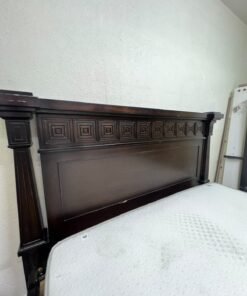 Large, classic double bed (king-size) with mattress, crafted from dark wood and featuring a headboard and footboard adorned with square-patterned detailing. - Image 5
