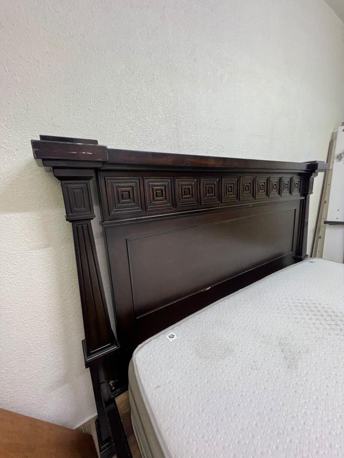 Large, classic double bed (king-size) with mattress, crafted from dark wood and featuring a headboard and footboard adorned with square-patterned detailing. - Image 7
