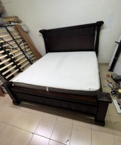 Large, classic double bed (king-size) with mattress, crafted from dark wood and featuring a headboard and footboard adorned with square-patterned detailing. - Image 8