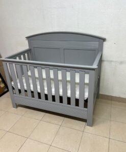 A convertible crib (such as the Serta Barrett model or the Dylan crib by Juniors, available at Centrepoint UAE) in an elegant gray color, featuring a classic, adjustable design that adapts to the various stages of a child's growth. - Image 8