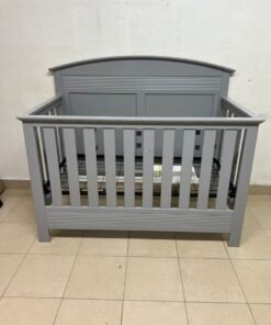 A convertible crib (such as the Serta Barrett model or the Dylan crib by Juniors, available at Centrepoint UAE) in an elegant gray color, featuring a classic, adjustable design that adapts to the various stages of a child's growth. - Image 11