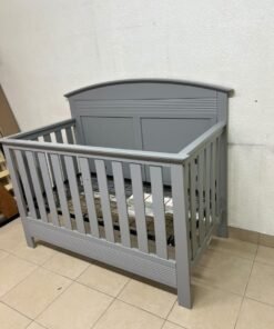 A convertible crib (such as the Serta Barrett model or the Dylan crib by Juniors, available at Centrepoint UAE) in an elegant gray color, featuring a classic, adjustable design that adapts to the various stages of a child's growth. - Image 6