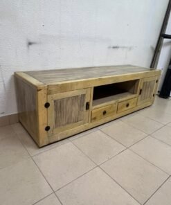 The TV stand shown in the image—a "Band TV" unit—is crafted from natural wood and features an industrial-style design. It includes two side doors, an open shelf in the center, and two small drawers at the bottom. - Image 7
