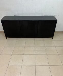A cabinet (such as a TV stand or sideboard) that appears as a glossy black storage unit with three doors and slender legs; it bears a strong resemblance to the IKEA BESTÅ collection (specifically the Selsviken/Stubbarp combination in black-brown with high-gloss doors). - Image 4