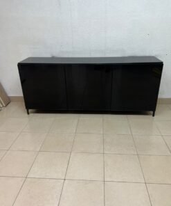A cabinet (such as a TV stand or sideboard) that appears as a glossy black storage unit with three doors and slender legs; it bears a strong resemblance to the IKEA BESTÅ collection (specifically the Selsviken/Stubbarp combination in black-brown with high-gloss doors). - Image 7